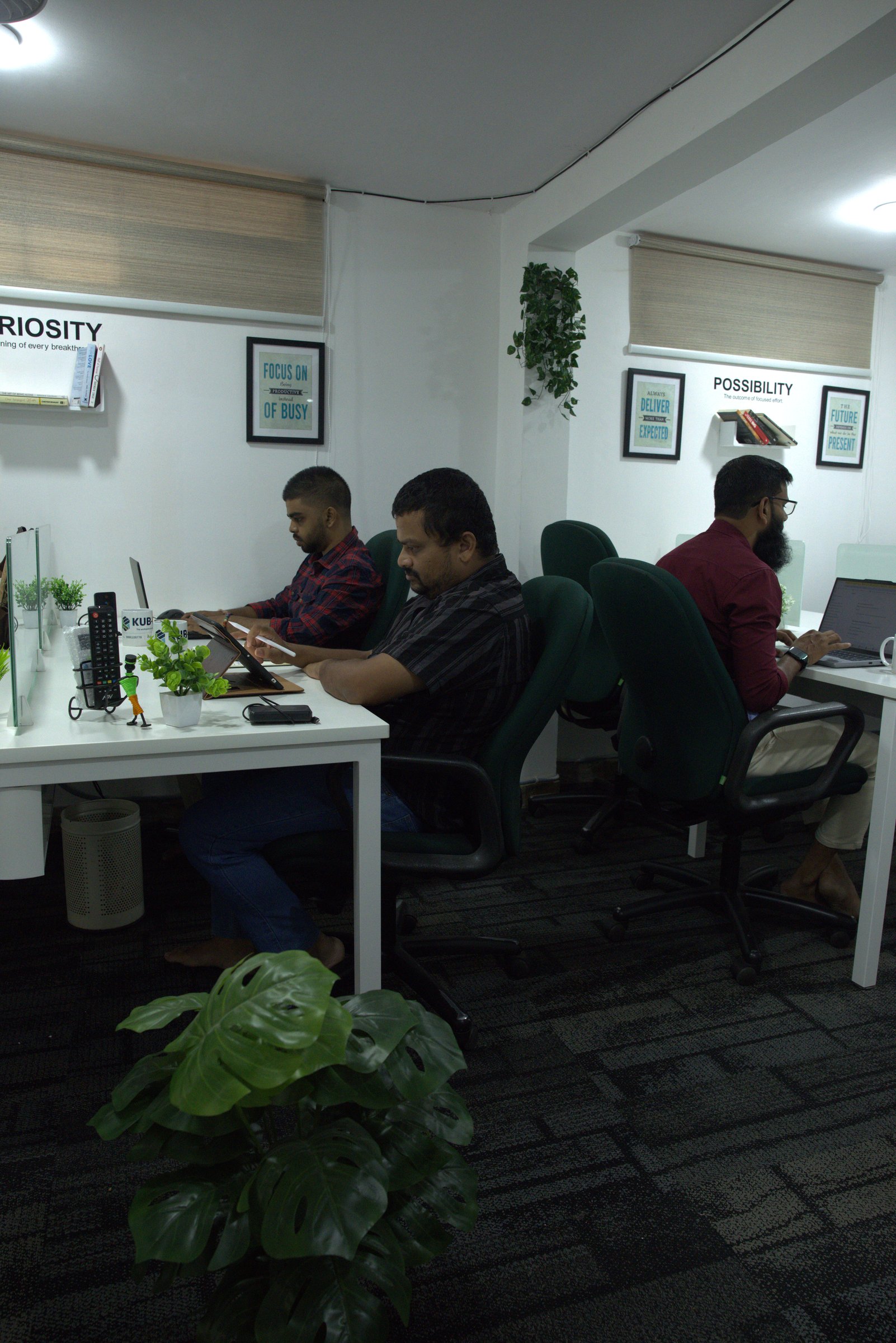 Workspace with people working silently in deep concentration