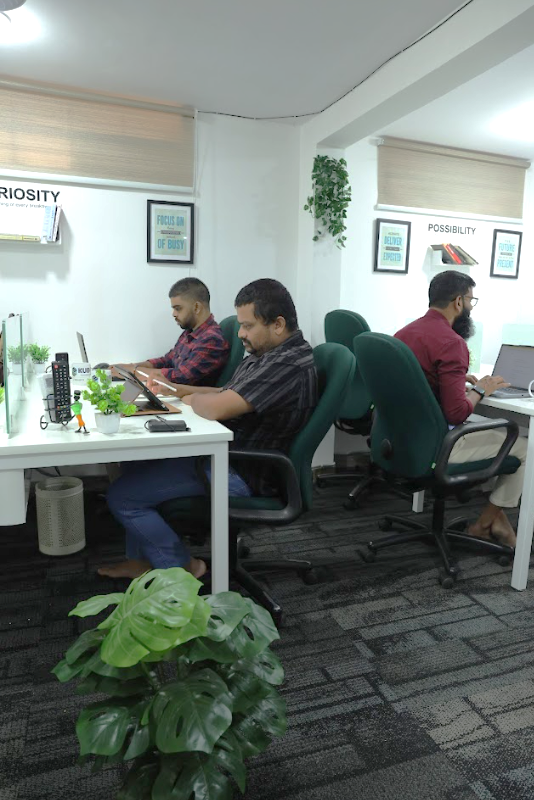 Workspace with people working silently in deep concentration